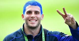 The story behind Adam Elliott's blue hair