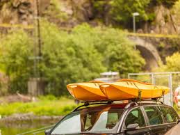 Once you've got your pool noodles, place them across the roof of your car. How To Strap Two Kayaks To A Roof Rack It S Easier Than It Seems