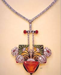 Carl Fabergè A rare antique blue topaz and diamond brooch, St Petersburg,  circa 1890. The natural sky-blue stone brilliant-cut weighing 134  carats,its deep gallery pierced in the form of a Greek key