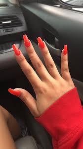 A coffin style nail is trendy, but solid red helps it transition from day to night. Orange Summer Coffin Acrylic Nails Orange Acrylic Nails Coffin Nails Designs Red Acrylic Nails