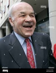 Former Enron CEO Kenneth Lay laughs as he leaves the federal courthouse for  the lunch break in his fraud and conspiracy trial, Tuesday, Feb. 14, 2006  in Houston. (AP Photo/Pat Sullivan Stock
