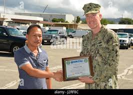 April 26, 2017) Naval Facilities Engineering Command (NAVFAC) Hawaii,  Commanding Officer Capt. Richard Hayes III presents the command's 2017  Employee of the Year Awards to six individuals and one team April 26