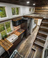 Grizzly By Backcountry Tiny Homes Tinyhome In The Kitchen You Ll Find A Gas Cooktop With Overhead Micr Tiny House Plans Tiny House Kitchen Tiny House Interior