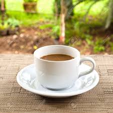 A style of table which almost looks like it originated in japan, it is coated in black lacquer and carries with it a very traditional and vintage look. Cup Of Coffee On The Table Stock Photo Picture And Royalty Free Image Image 9556569