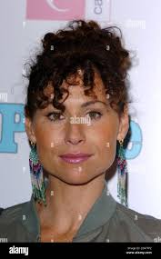 Minnie Driver poses as she arrives at the Ella Enchanted premiere held at  the Beekman theatre in New York,