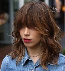 Layered bobs, fringed bangs, choppy layers, and long hair with layers beginning at the temples are the most flattering styles. 50 Best Styles For Medium Length Hair With Bangs Hair Adviser