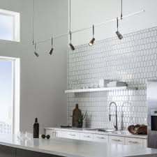 High vaulted or angled ceilings need several layers of light to adequately light all the extra space track lights are another popular and versatile way to light sloping ceilings. 20 Kitchen Track Lighting Ideas To Get Your Cooking On Track