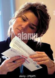 Cowlitz County Auditor Kris Swanson carefully checks a ballot signature at  her office in Kelso, Wash., Wednesday, Nov. 17, 2004. Hundreds of ballots  were checked Wednesday before the county could certify the election. With  all counties reporting ...