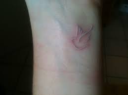 Check it below amazing ideas with attractive images. White Ink Flying Dove Tattoo On Wrist