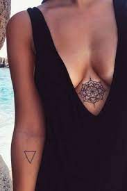Whether You Hold Rihanna Responsible Or Not Sternum Tattoos Are Having A Moment Right Now And By The Looks Of Sternum Tattoo Tattoos Chest Tattoos For Women