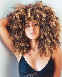 Click here to see 35 celebs wearing varying shades of the color. Honey Blonde Curls With Bangs Curly Hair Styles Curly Hair Styles Naturally Hair Styles