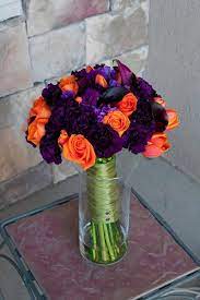 Bride holding bridal bouquet with white, pink and purple flowers. This Is The Bouquet I Want The Bridesmaid To Have And Mine The Dark Purple Purple Wedding Flowers Purple Wedding Decorations Orange Purple Wedding