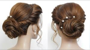 Leaving two sections of hair from the sides, gather the rest of your hair and tie it in a long bun at the back. New Low Bun Hairstyle For Girls Party Updo Hair Tutorial Youtube