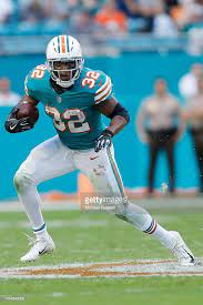 Kenyan Drake Of The Miami Dolphins Runs Wih The Ball Against The Nfl Miami Dolphins Miami Dolphins Football Miami Dolphins Players