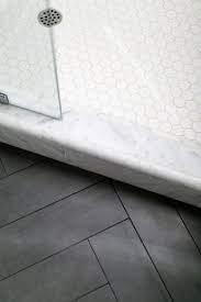 See more ideas about bathroom flooring, flooring, herringbone bathroom floor. Lauren Evans Interiors Designed This Guest Bath Accented By Herringbone Porcelain Tile Floors Visual Com Shower Floor Tile Marble Showers Bathroom Floor Tiles