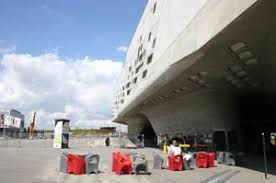 The main volume of the building, raised high above the ground on a series of concrete cones, maintains a large degree of transparent porosity on the ground. Wolfsburg Sehenswurdigkeiten Stadte Wolfsburg Goruma