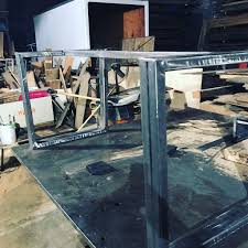 Shoe rack constructed from 3/4 tube steel and complete with red oak. Bases Tagged Custom Table Legs Chicago Fabrications