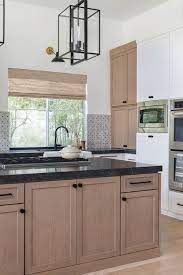 Upgrade to one of these for free: Modern Farmhouse Kitchen Light And Breezy Town Country Living White Oak Kitchen Modern Farmhouse Kitchens Black Kitchen Countertops