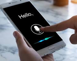 Image of person using voice search on their smartphone to find information on a website