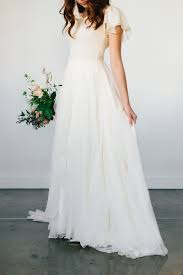 When you wear one of our dresses, you feel confident! Modest Wedding Dress With Flutter Sleeves And A Trumpet Skirt From Alta Moda Modest Bridal Modest Bridal Gowns Chiffon Wedding Dress Beach Wedding Dress Flowy