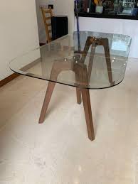 This glass dining table is ideal for any dining room set, giving a clean and polished look to any room. Dining Table Elegant Glass Top And Wooden Legs Furniture Home Living Furniture Tables Sets On Carousell