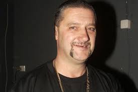 Notorious Aussie crook Mark 'Chopper' Read dies of liver cancer