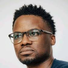 With respect Casey Babb, those are canisters for colored smoke, which are  commonly used at protests, not a suicide vest. The man isn't even wearing a  vest at all — It's an