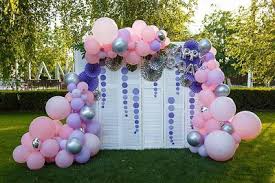 A friend threaded a heavy chain through the bottom hem. How To Prevent Balloon Decor From Popping In Outdoors Heat
