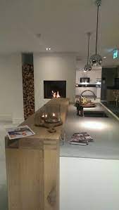 kookeiland met houten bar en haard op bladhoogte in 2020 modern kitchen interiors interior design kitchen kitchen interior design modern