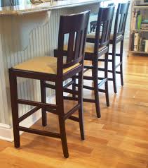 three pottery barn counter stools