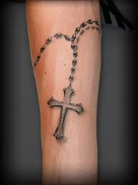 The cross is filled with loops, flowers of knots, and pointed tips, while the circle across the intersection is filled with the tiniest of details. 100 Best Tattoo Designs And Symbols For Men Women 2021