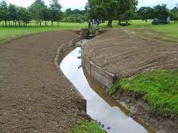 Building a pond retaining wall takes about 5 steps, most of which repeat themselves until you are satisfied. Golf Club Retaining Walls With Railway Sleepers Retaining Wall Lawn And Landscape Retaining Wall Drainage