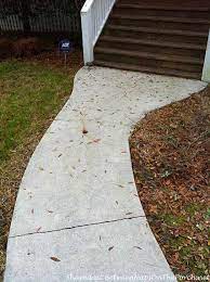 Outdoor decor concrete patio makeover concrete diy patio makeover side yard landscaping garage decor concrete overlay backyard front porch stone. Concrete Walkway Transformed With Beautiful Cobble Stone Pavers Between Naps On The Porch