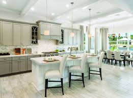 Impress Guests With This Exquisite Kitchen Accented By Neutral Tones And Brilliant Brightness From Julington Lakes In S Home House Design Kitchen Dining Combo