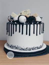 The 70th birthday cake pictured below is one that is easy to create at home. Black And White Drip Cake Loaded Drip Cakes Birthday Cake For Him Simple Birthday Cake Simple Cake Designs