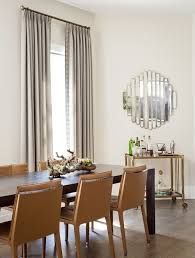 Chic Dining Room Features A Dark Stained Dining Table Lined With Caramel Colored Leather Dining Ch Dining Room Layout Chic Dining Room Dining Room Contemporary