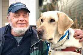 Partners in sight: Community advocate graduates with new guide dog
