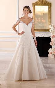 Off the shoulder wedding dresses have the straps hanging below the top of the shoulder towards the top of the bride's arms, running parallel to her collar. Off The Shoulder Lace Wedding Dress With Sleeves Stella York Wedding Gowns