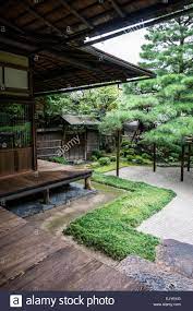 View Of A Traditional Japanese Garden With Wooden Veranda And Raked Gravel In Kyoto Japan Stock Photo Japanese Garden Garden Japanese Garden Design