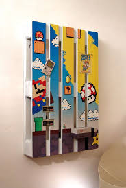 Palletes Transformed Into Functional Nerdy Wall Decor Pallet Wall Art Game Room Decor Game Room Design