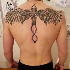 Holy cross tattoo with flying dove and holy light in background. Top 30 Back Tattoos Incredible Back Tattoo Designs Ideas