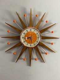 Designed in the 1950's, the sunburst wall clock is part of a collection first designed by george nelson. 21 Inch Hand Made Mid Century Style Starburst Sunburst Clock By Royale Welby Style Medium Teak Rays With Tangerine Dial