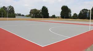Minimum distance between baselines and backstops is 6.4m, and the minimum distance between side indoor tennis court: Netball Court Surfaces Construction Resurfacing