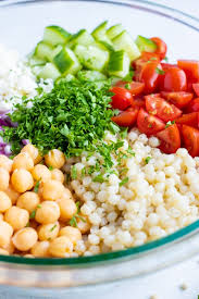 Mound mixture in center of a serving platter. Mediterranean Couscous Salad With Tomatoes With Feta Tomatoes Evolving Table