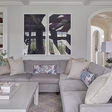 An ivory carpet and couch, taupe tables and walls, and purple accessories. Lavender And Gray Living Room Colors Design Ideas