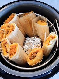 Remove tamales from bag, wrap in foil, and place them on sheet pan. How To Cook Frozen Tamales In 2021 15 Best Cooking Methods The Tasty Tip
