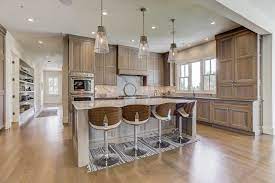 The ornate wood hood above the cooktop. Calming Quarter Sawn Crystal Cabinets