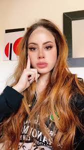 Person with Long Auburn Hair in Artistic Setting