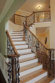 Curved stairs wrought iron handrail. 17 Decorative Wrought Iron Railings For Any Style Home Doorways Magazine
