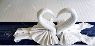 Towel animals are often used. Beautiful White Towel Folded In Heart Or Two Swan Shape On Stock Photo Picture And Royalty Free Image Image 128369003